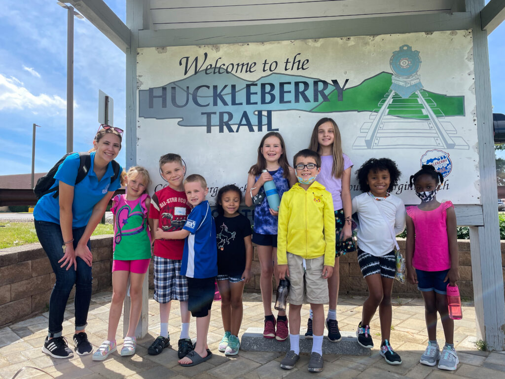 Group of children with teacher at Huckleberry Trail mural