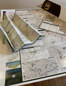 Collection of paper maps on a table